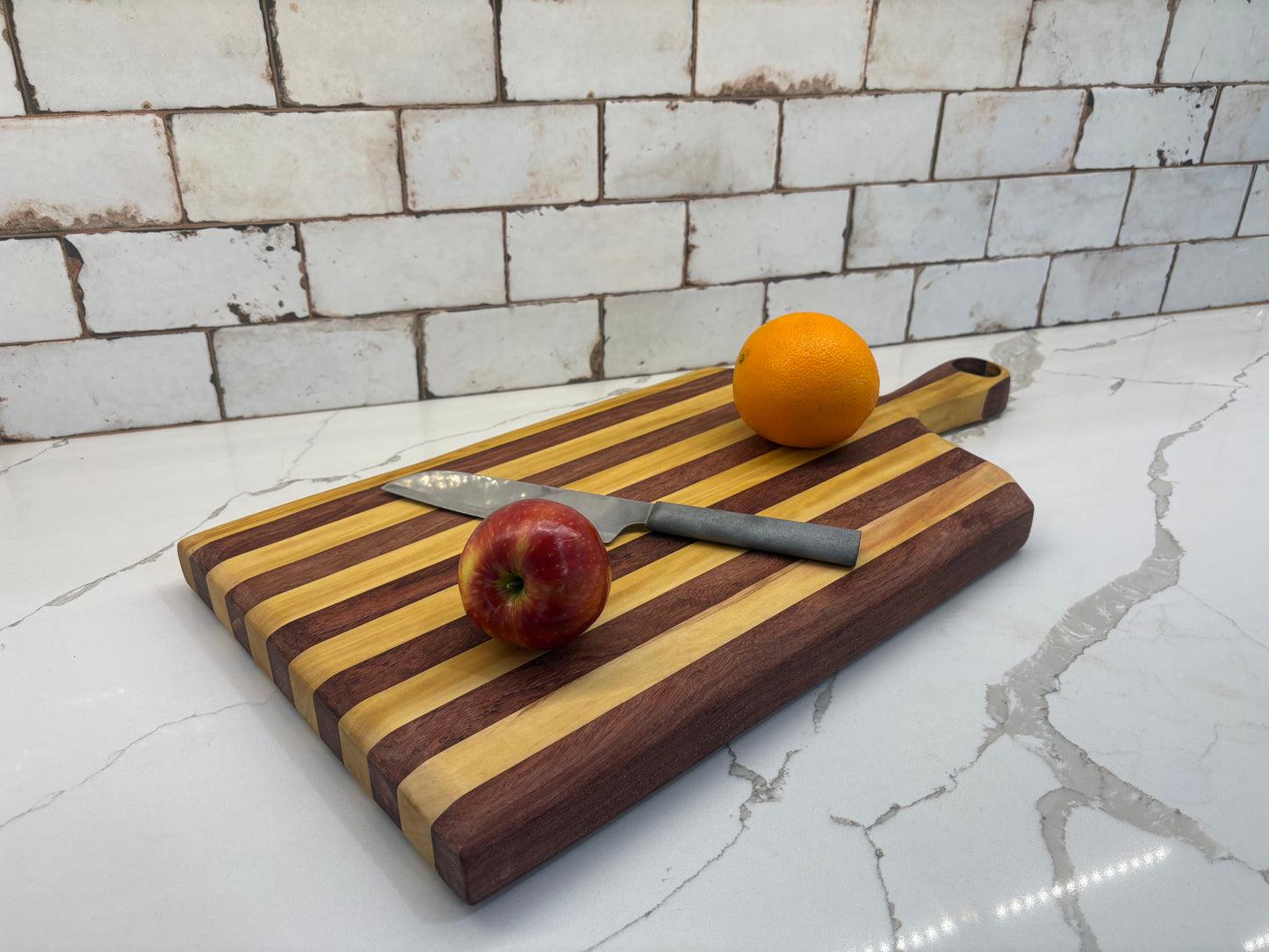 Padauk and Yellow Heart striped board - carved handle
