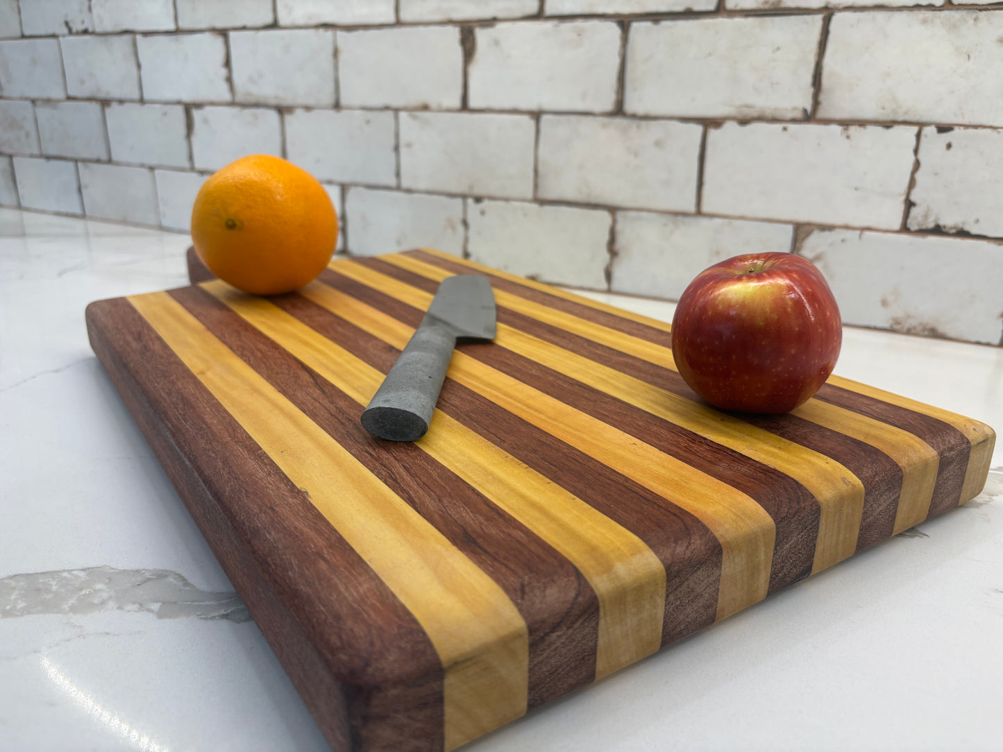 Padauk and Yellow Heart striped board - carved handle (Copy)