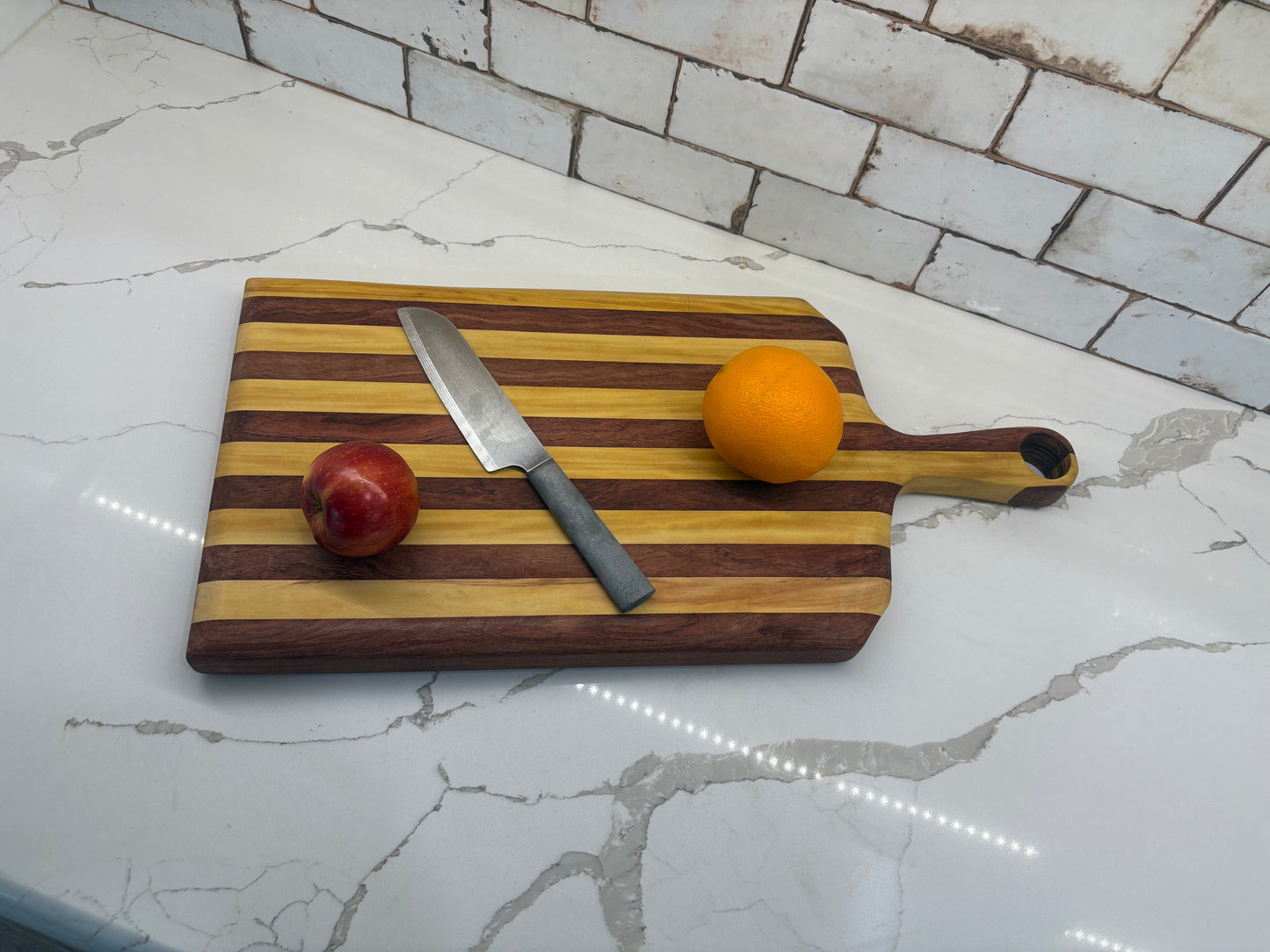 Padauk and Yellow Heart striped board - carved handle