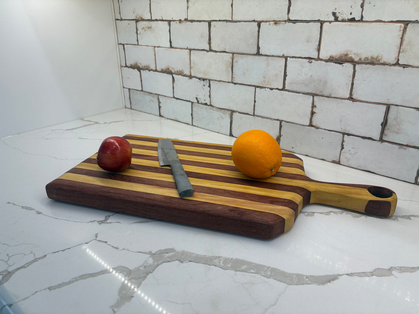 Padauk and Yellow Heart striped board - carved handle