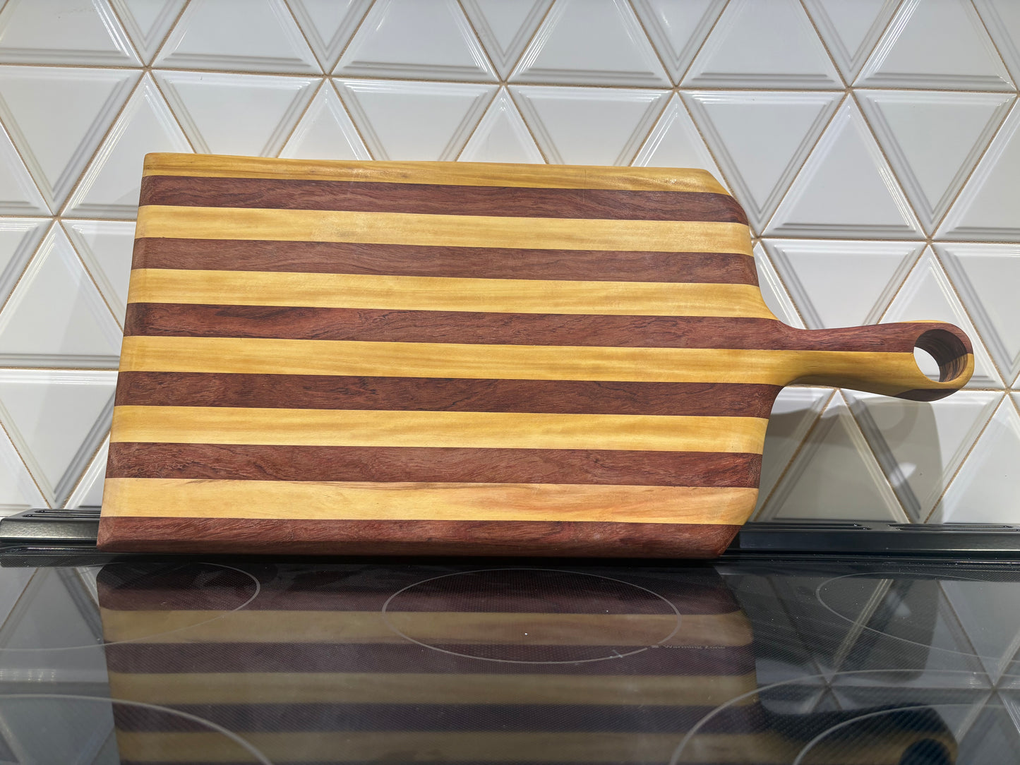 Padauk and Yellow Heart striped board - carved handle